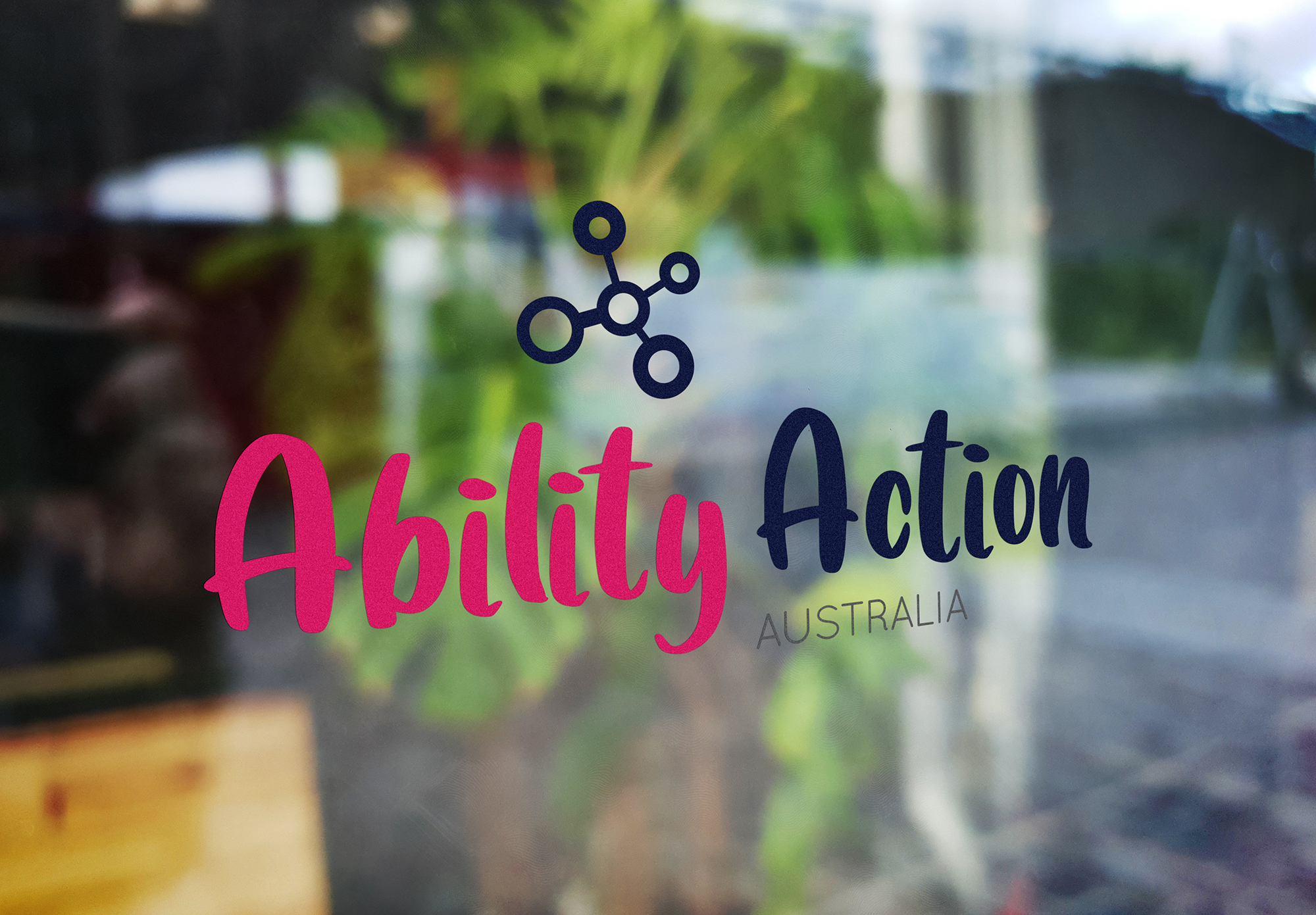 Ability Action Australia logo on window
