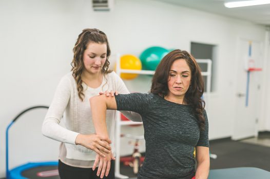 NDIS physiotherapy providers helping woman with arm or joint issue