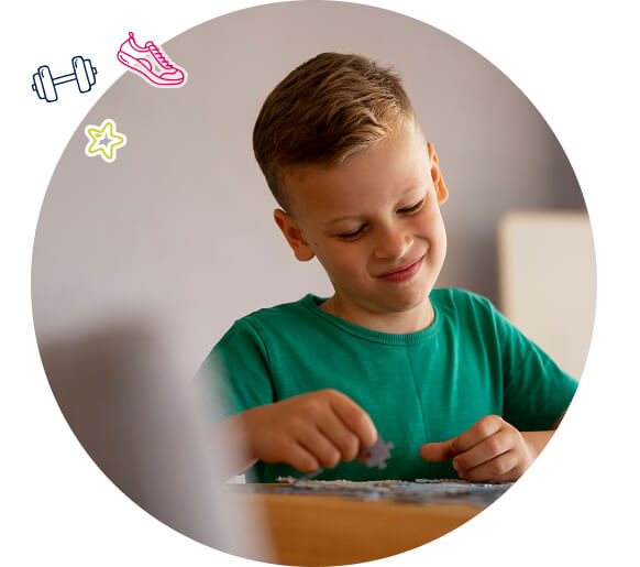 A boy playing a jigsaw puzzle